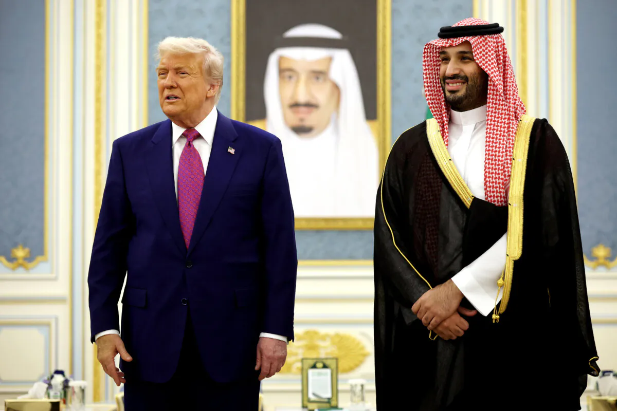 U.S. President Donald Trump and Saudi Crown Prince Mohammed bin Salman interact with officials during a coffee ceremony at the Saudi Royal Court in Riyadh, Saudi Arabia, on May 13, 2025. (Win McNamee/Getty Images)