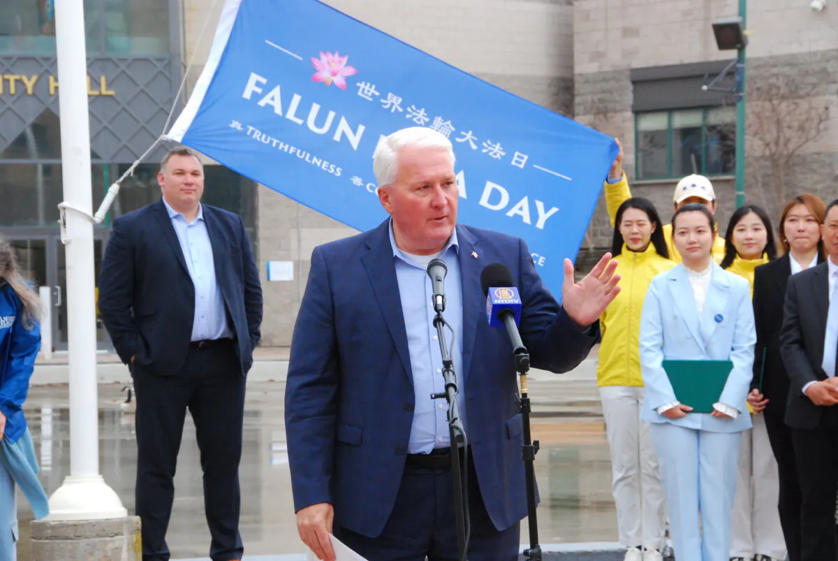 Conservative MP for Barrie-Innisfil John Brassard speaks during a flag-raising event in Barrie, Ont., to mark the 33rd Annual World Falun Dafa Day on May 1, 2025. (NTD/The Epoch times)