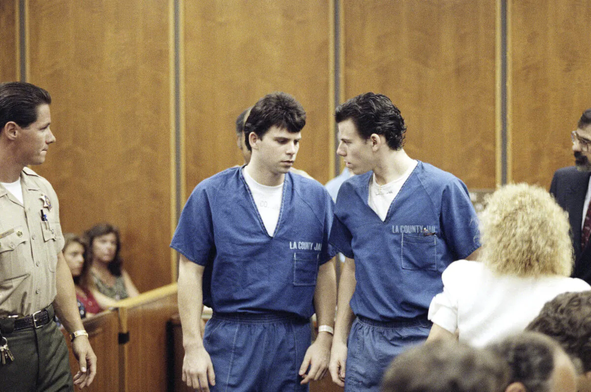 Lyle (L) and Erik Menendez leave a courtroom in Santa Monica, Calif., on Aug. 6, 1990. (Nick Ut/AP Photo)