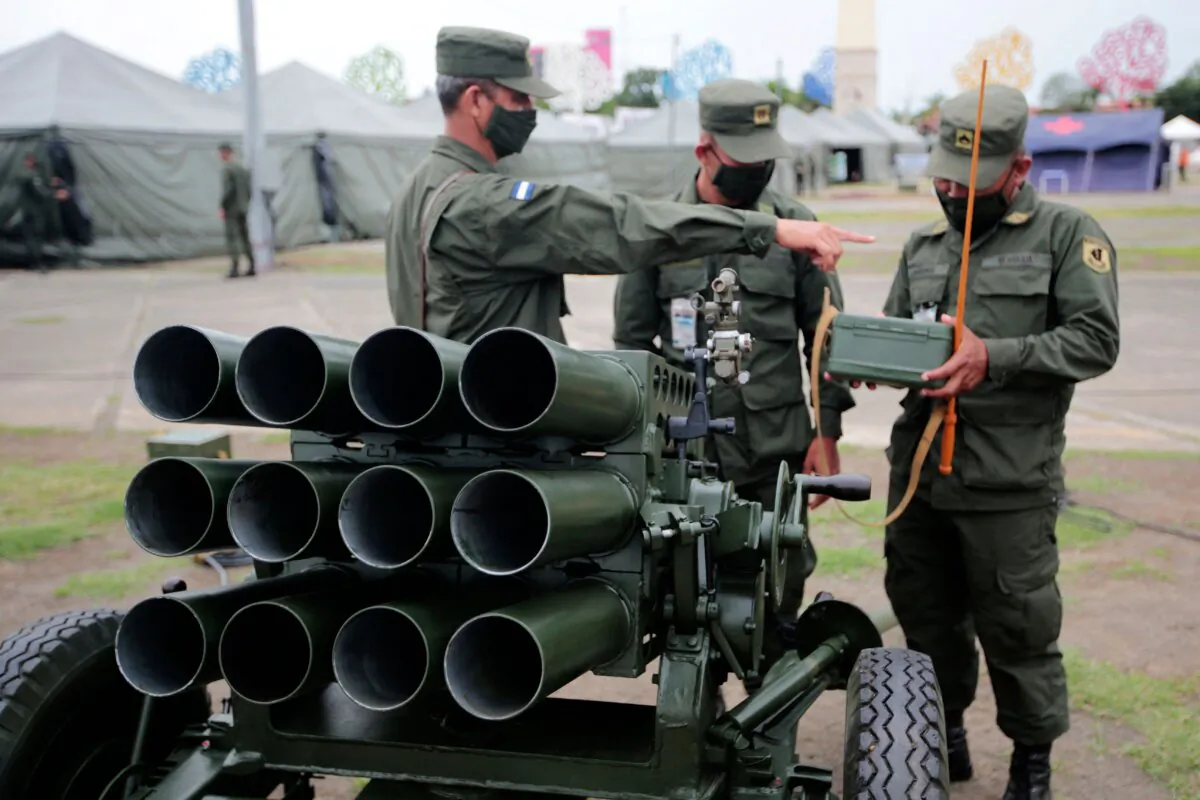 Members of Nicaragua's army stand next to a Russian-made 107 mm launcher during an exhibition of technique, means, and military equipment to commemorate the 43rd anniversary of Nicaragua's army, in Managua, Nicaragua, on Aug. 3, 2022. (Oswaldo Rivas/AFP via Getty Images)