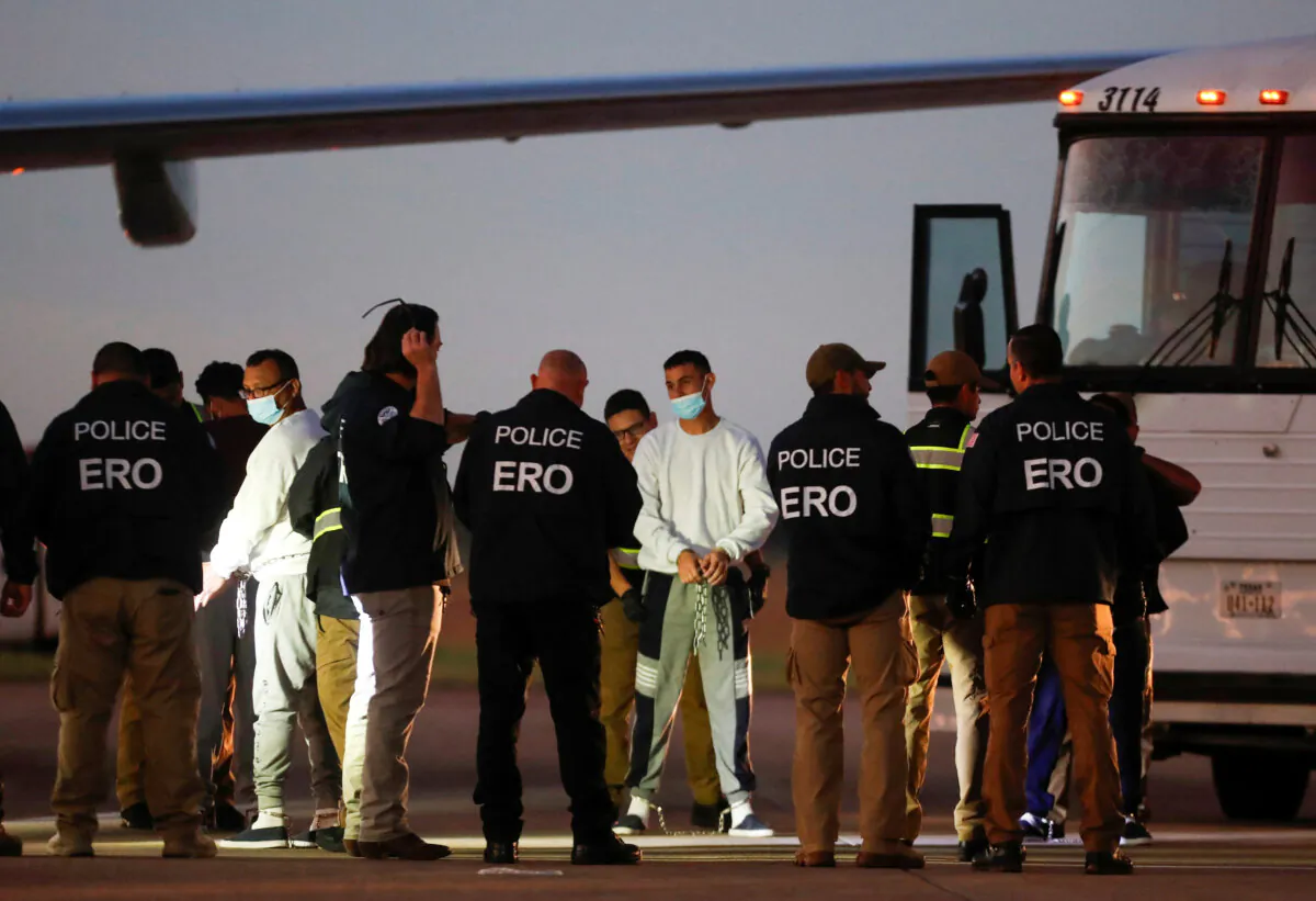 Venezuelan migrants are patted down before boarding a repatriation flight in Harlingen, Texas, on Oct. 18, 2023. (Daniel Becerril/Reuters)