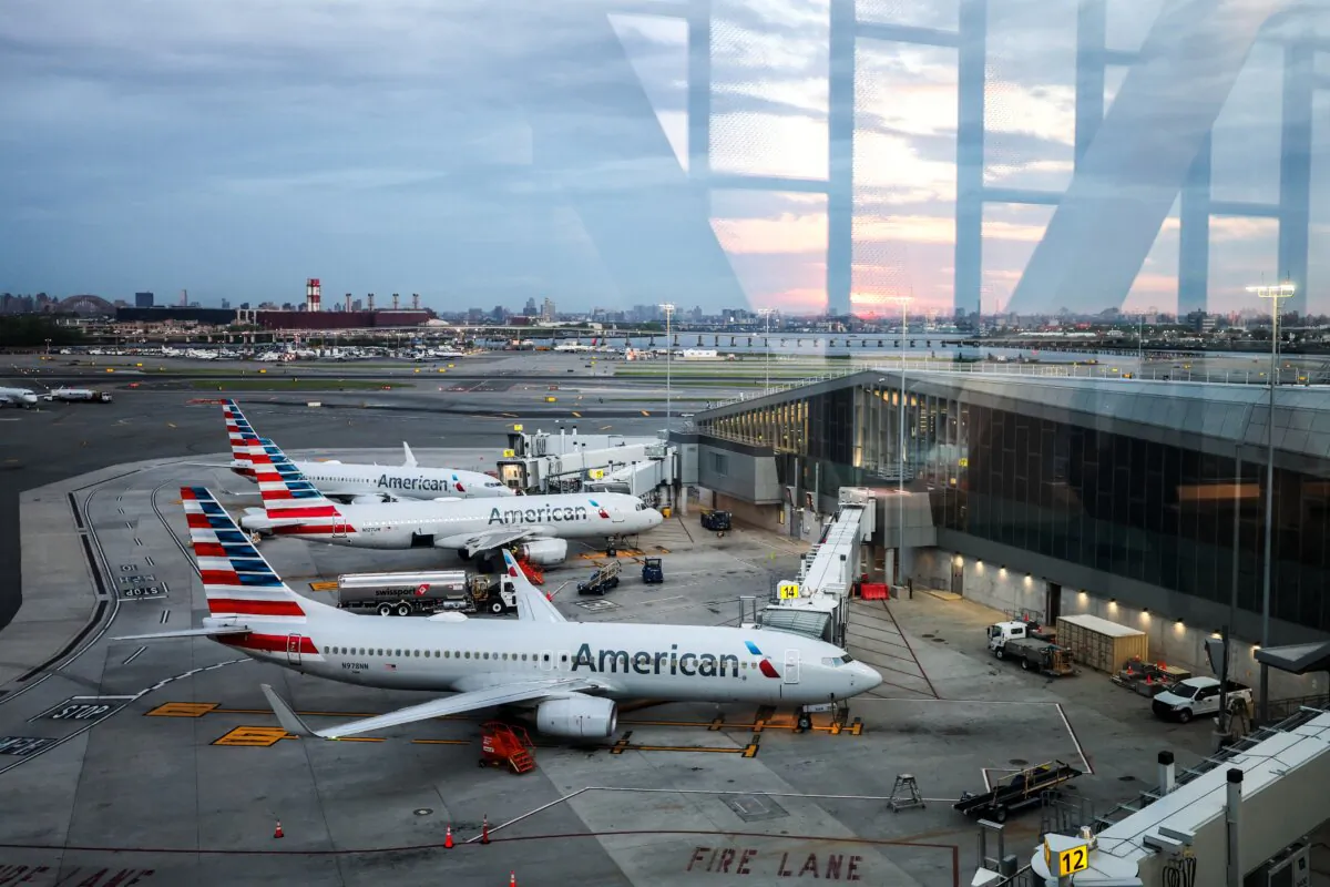 A Boeing 737 American Airlines passenger aircraft (foreground) and a Airbus A320 American Airlines passenger aircraft (center) at a terminal at LaGuardia Airport in New York, on April 30, 2025. (Charly Triballeau/AFP via Getty Images)