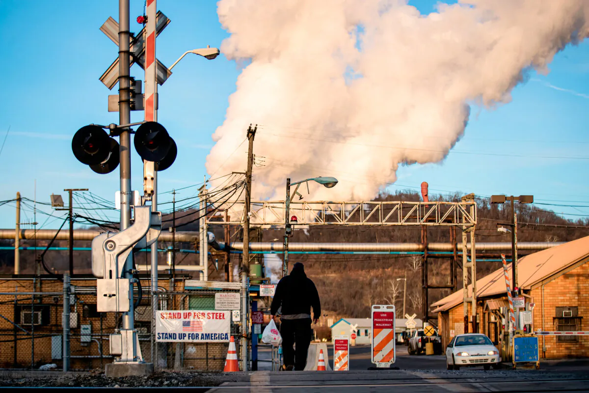 An employee walks toward the U.S. Steel Clairton Works in Clairton, Pa., on March 11, 2018. (Drew Angerer/Getty Images)