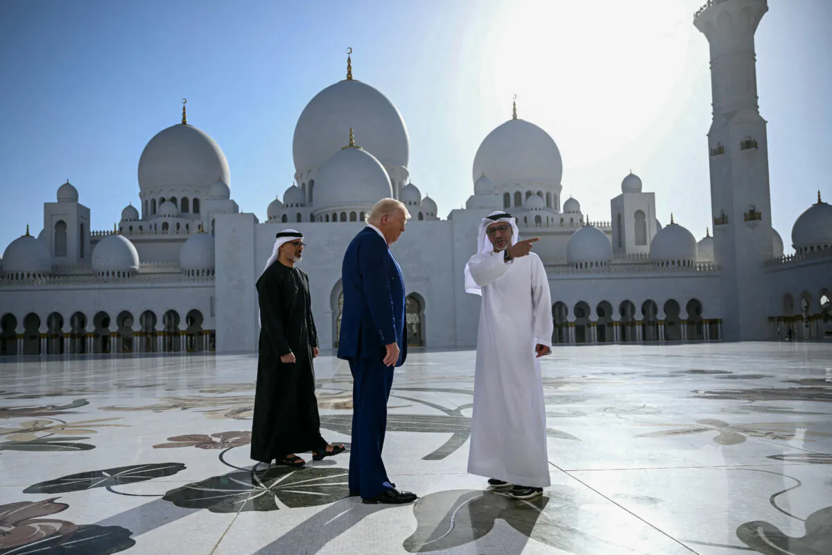 Yousif al-Obaidli (R), director-general of the Sheikh Zayed Grand Mosque, accompanies U.S. President Donald Trump on a tour of the mosque in Abu Dhabi on May 15, 2025. (Brendan Smialowski/AFP via Getty Images)