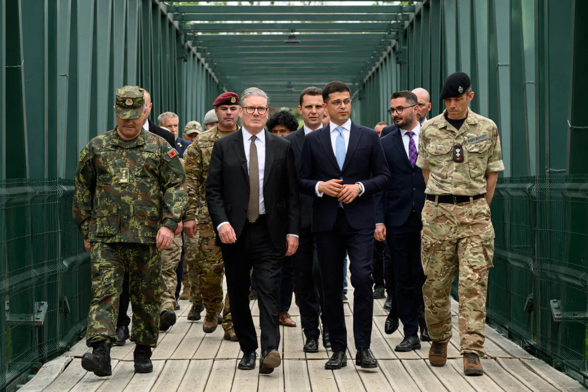 British Prime Minister Keir Starmer (2nd L) after speaking to British and Albanian troops about their involvement with training Ukrainian troops under Operation Interflex, during a visit to Tirana before the European Political Community Summit, on May 15, 2025. (Leon Neal/AFP via Getty Images) 