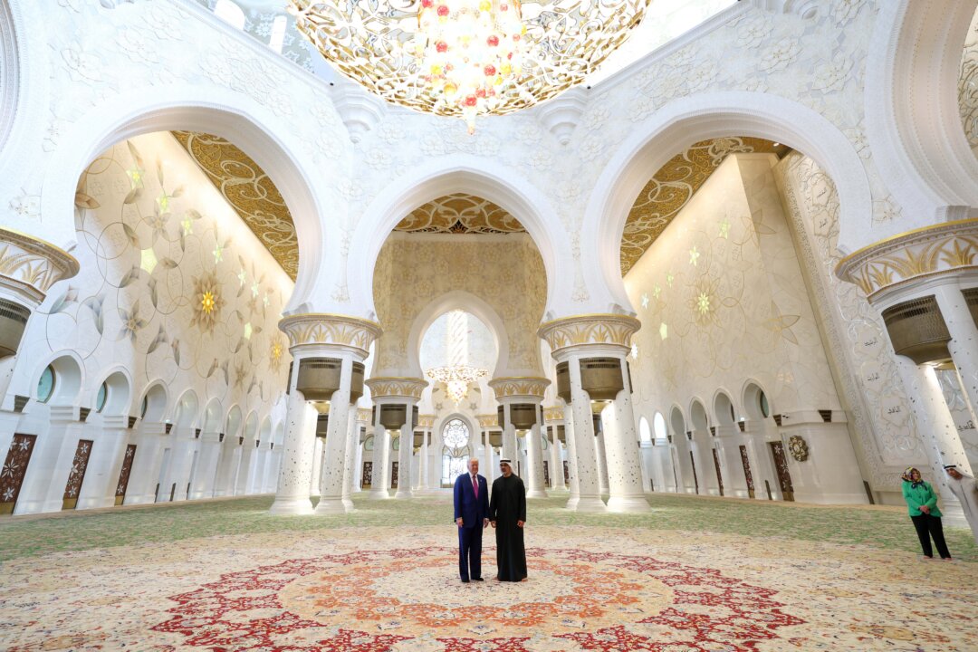 NextImg:Day in Photos: Donald Trump in UAE, Fire in Abidjan, and Colorful Village