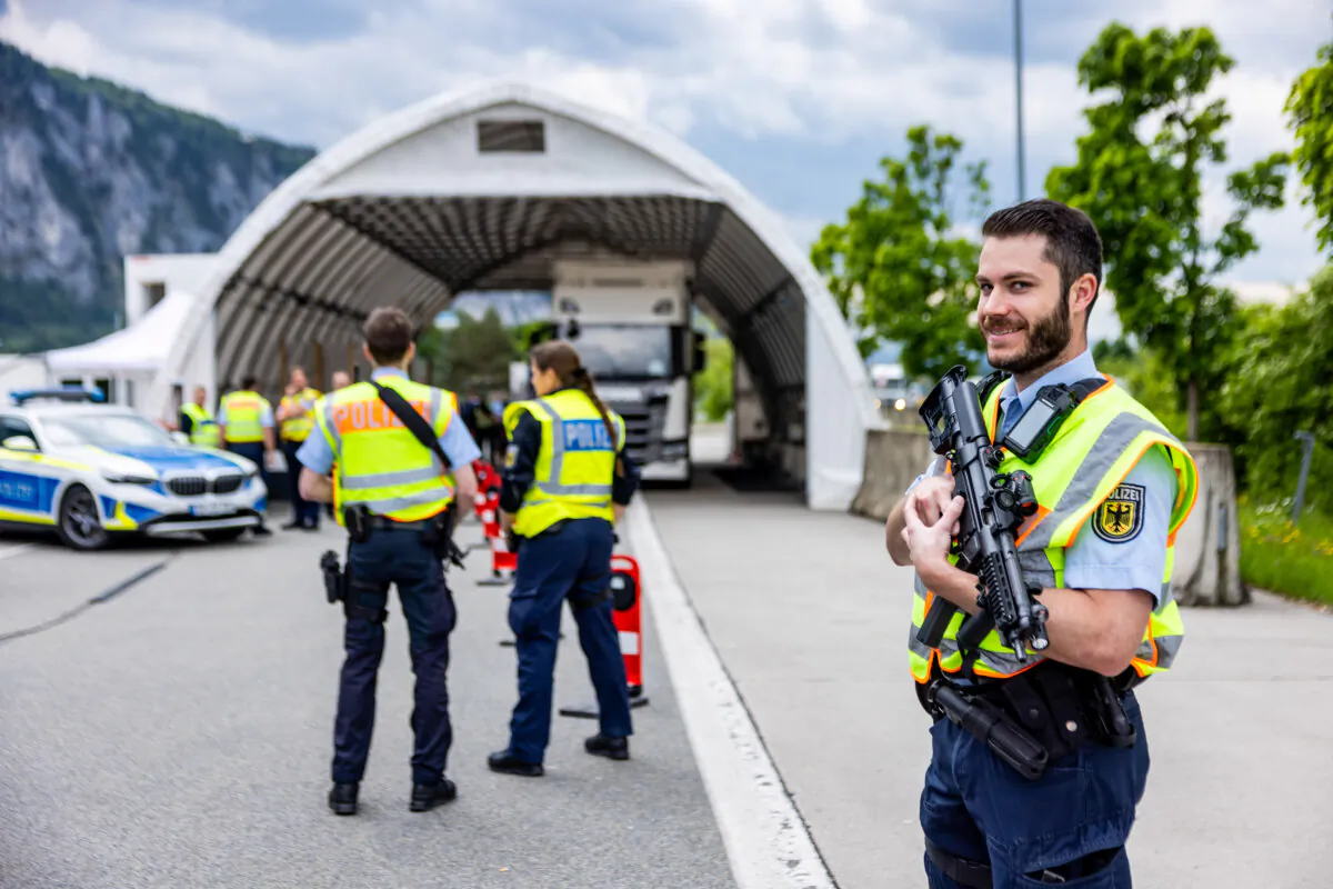 A policeman guards the border crossing while a truck is inspected at the Germany-Austria border crossing at Kiefersfelden, Germany, on May 15, 2025. (Jan Hetfleisch/Getty Images)