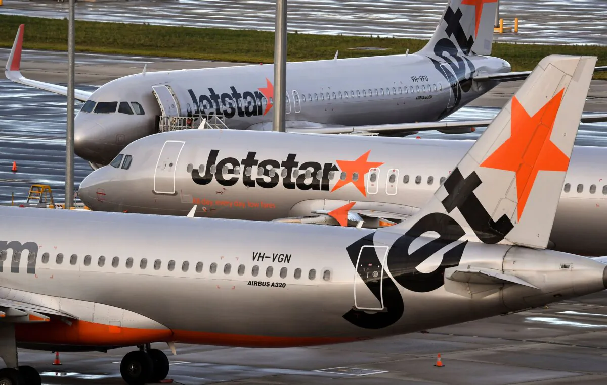 Australian airline Jetstar planes sit idle on the tarmac at Tullamarine Airport in Melbourne, Australia, on April 12, 2020. (William West/AFP via Getty Images)