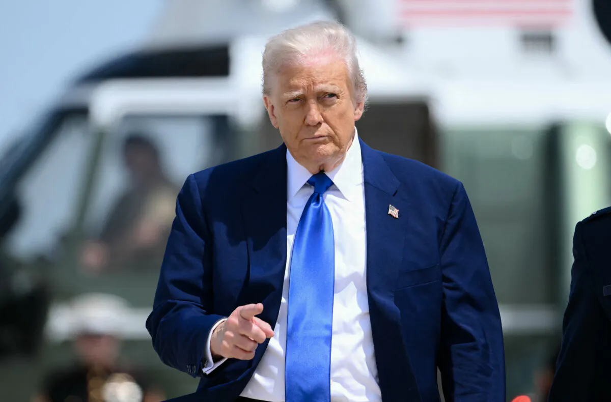 President Donald Trump gestures as he walks to Air Force One at Joint Base Andrews in Maryland on May 12, 2025. (Brendan Smialowski/AFP via Getty Images)