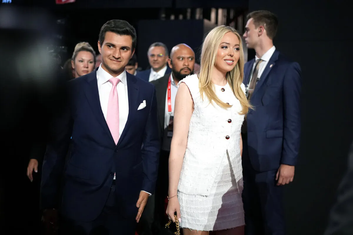 Tiffany Trump, daughter of former President Donald Trump, walks with her husband Michael Boulos (L) on the second day of the Republican National Convention at the Fiserv Forum in Milwaukee, Wis., on July 16, 2024. (Andrew Harnik/Getty Images)