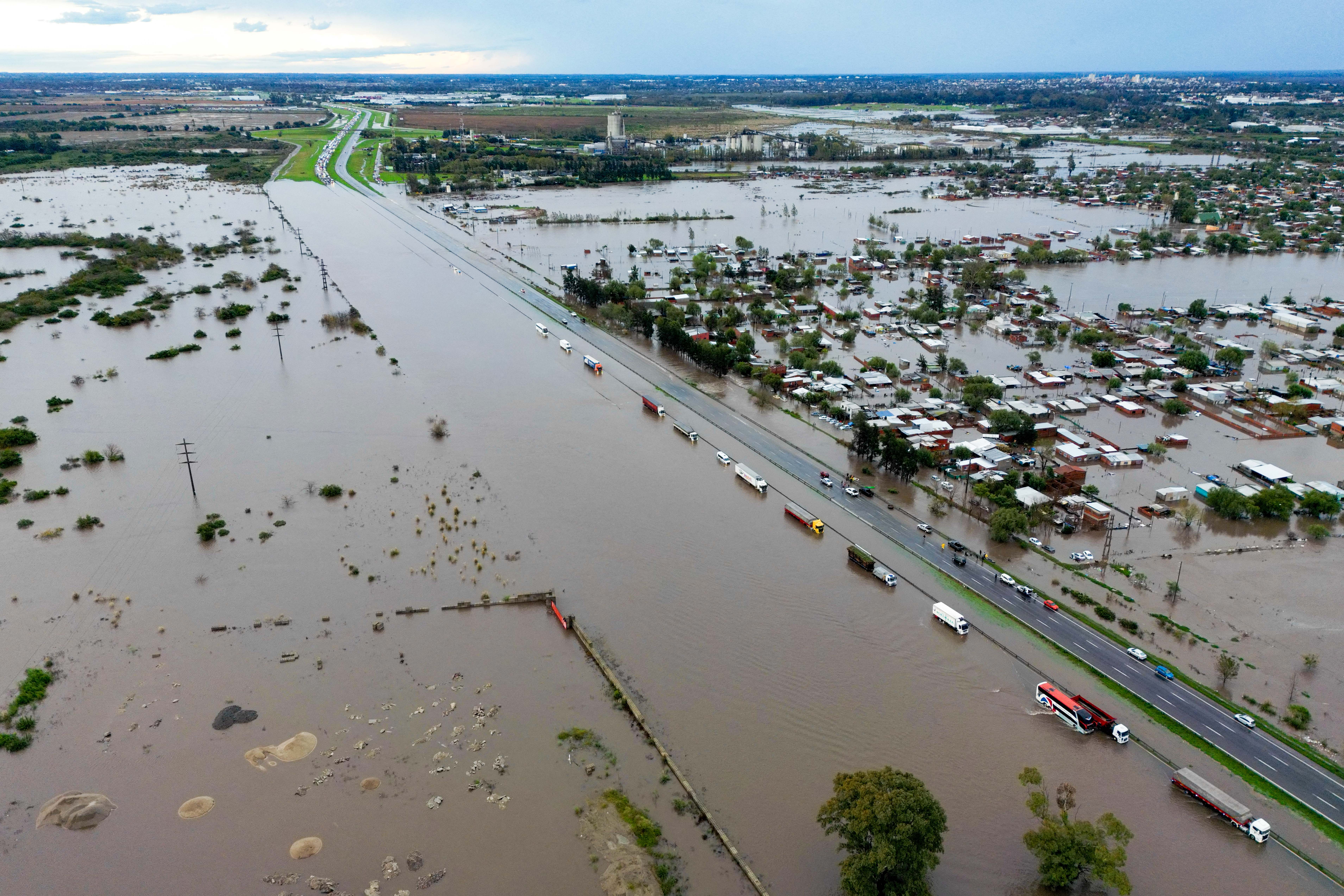 Day in Photos: Floods in Argentina, 95-Year-Old Alligator, and Endurance Event
