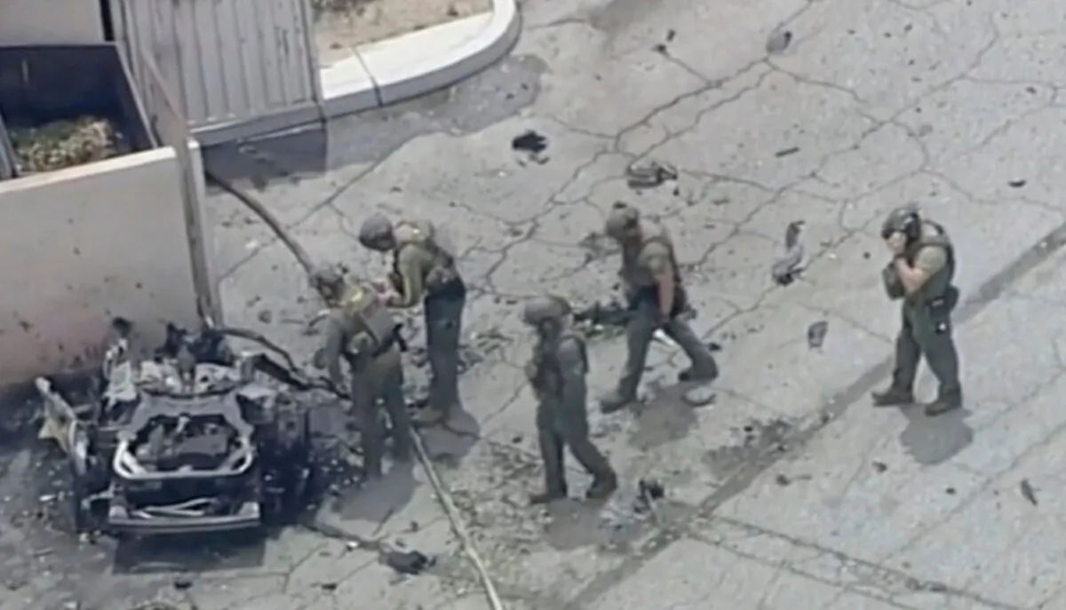 Law enforcement investigate a vehicle after an explosion in Palm Springs, Calif., on May 17, 2025. (ABC7 Los Angeles via AP)