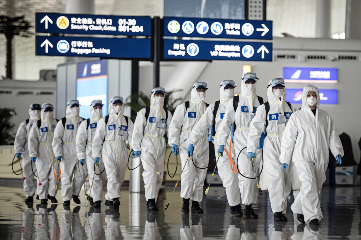 Firefighters prepare to conduct disinfection at the Wuhan Tianhe International Airport in Wuhan, Hubei Province, China, on April 3, 2020. (Getty Images)