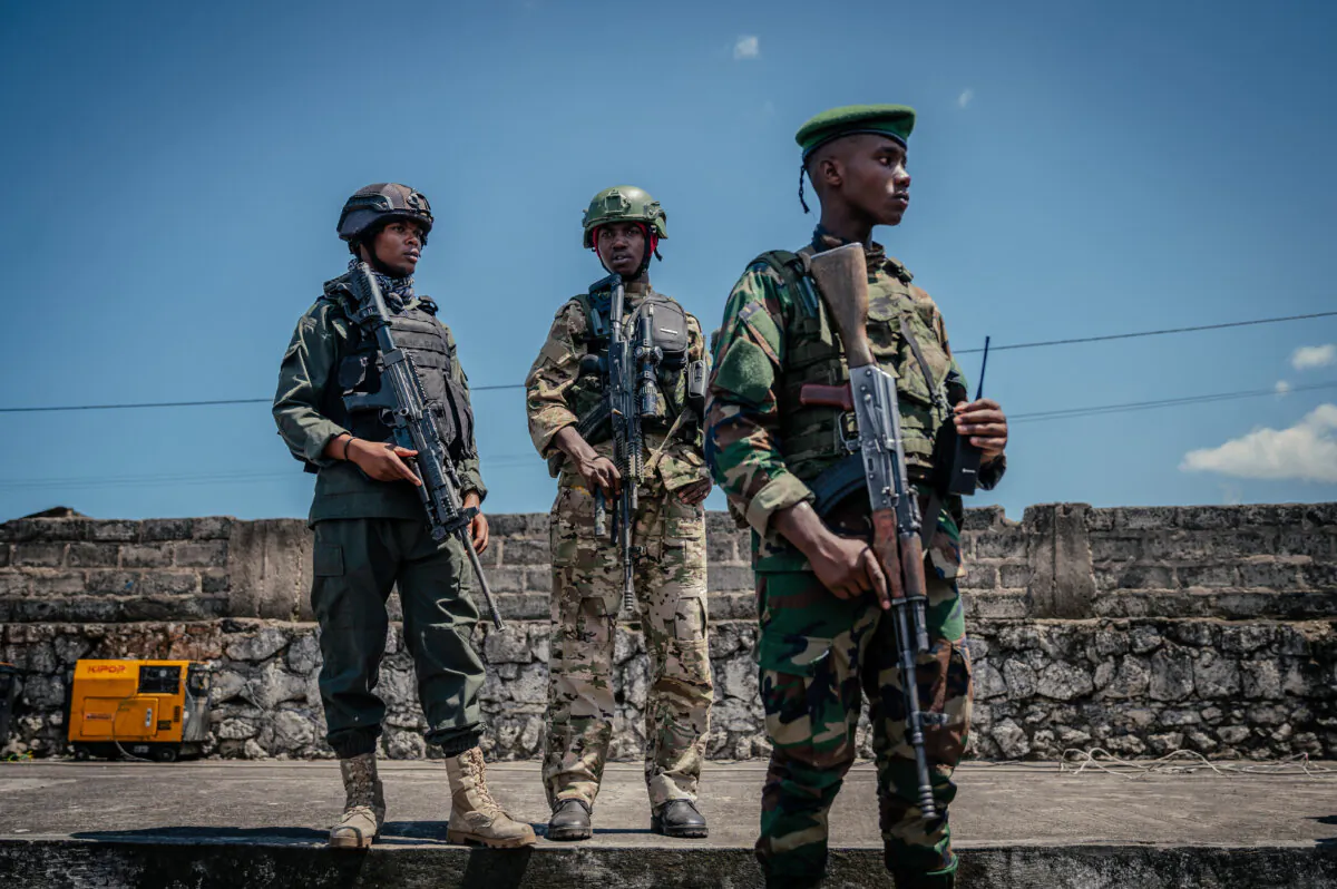 M23 rebel soldiers provide security, some seated on rooftops near the stadium, others in pickups close to the stands, during a thanksgiving service organized by the M23/AFC administration at Stade de l'Unité in Goma, Congo, on May 18, 2025. (Jospin Mwisha/AFP via Getty Images)