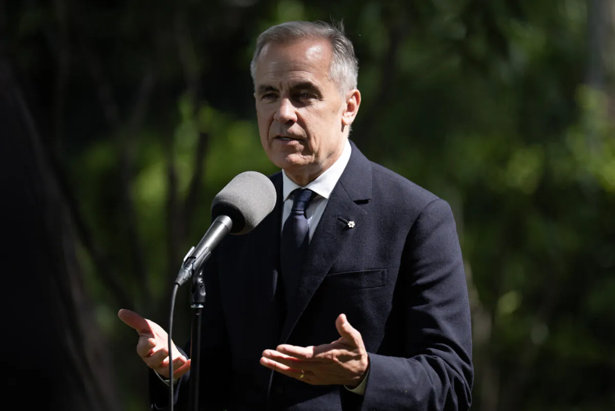 Prime Minister Mark Carney responds to a question as he speaks with media in Rome at the Official Residence of the Canadian Ambassador to Italy on Sunday, May 18, 2025. (The Canadian Press/Adrian Wyld)