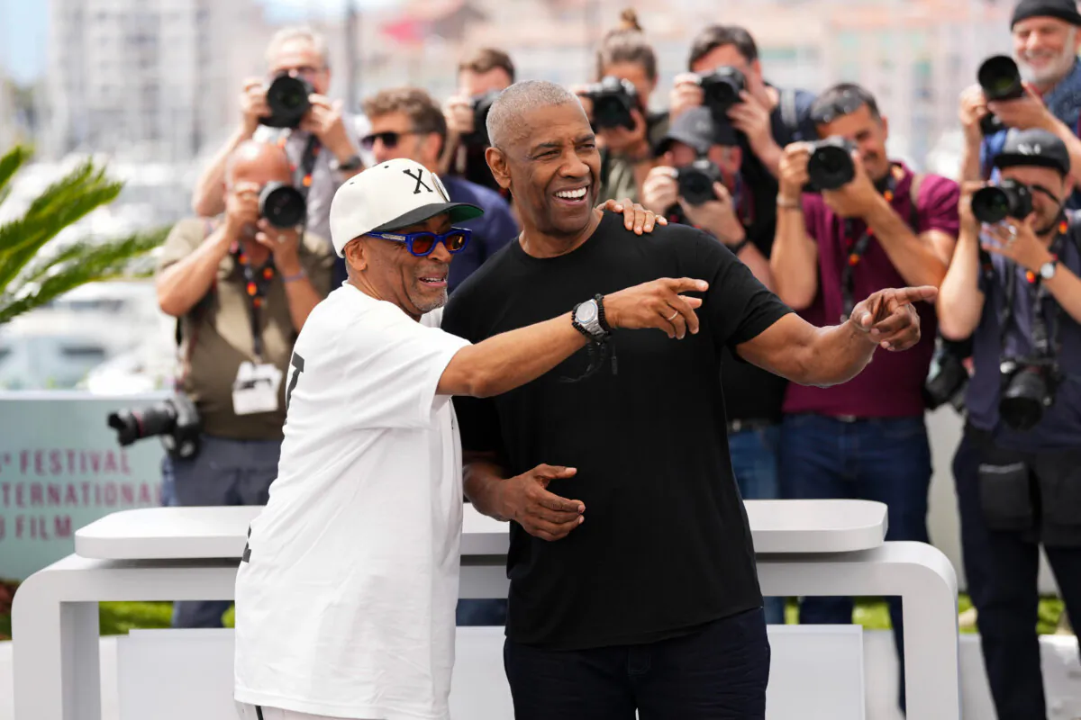 Denzel Washington (R) and Spike Lee at the photo call for the thriller "Highest 2 Lowest" at the Cannes Film Festival in southern France on May 19, 2025. (Scott A Garfitt/Invision/AP)