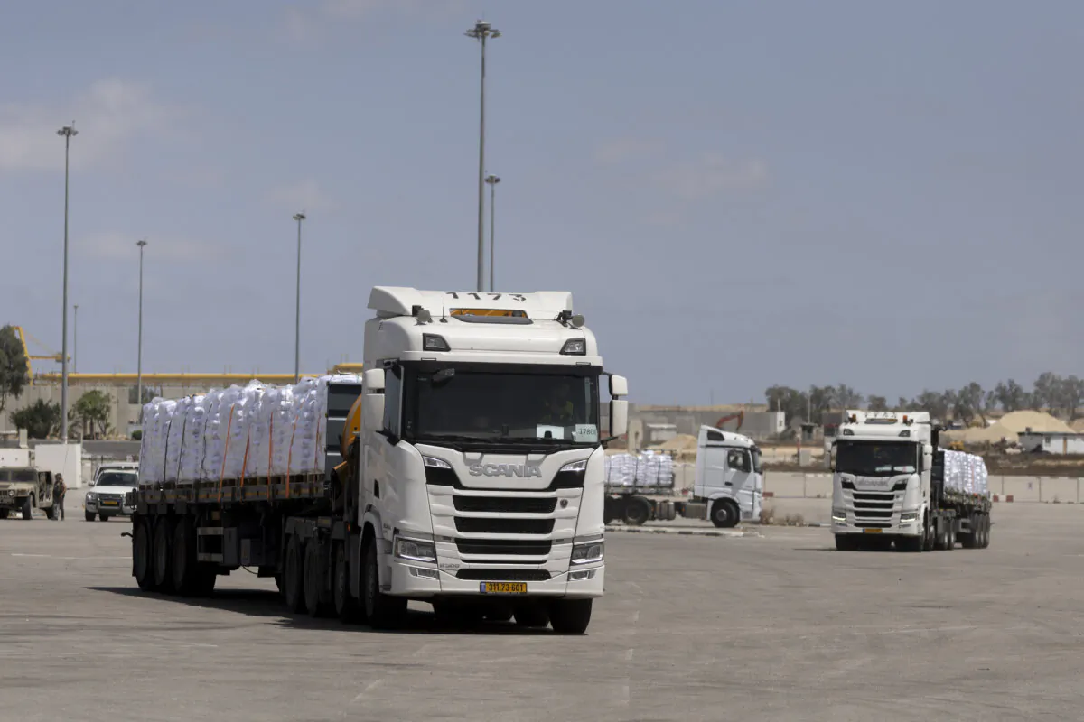 Aid trucks stand at the Israeli side of the Kerem Shalom Crossing on their way to the Gaza Strip, in Southern Israel on May 19, 2025. (Amir Levy/Getty Images)