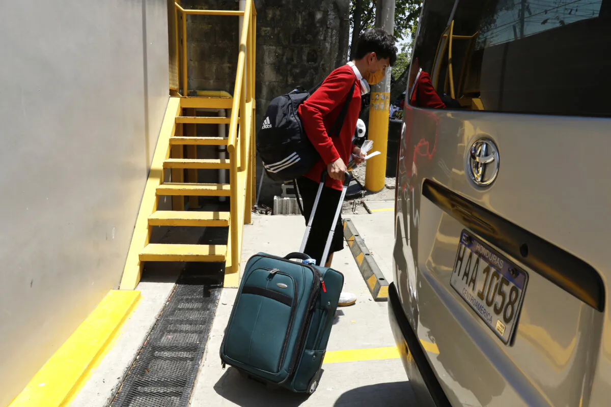 A Honduran migrant who returned voluntarily from the United States walks after arriving at Ramon Villeda Morales Airport in San Pedro Sula, Honduras, on May 19, 2025. (Delmer Martinez/AP Photo)