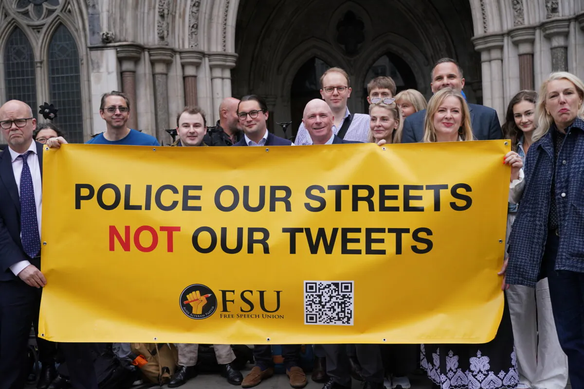 Toby Young (L) with Former Conservative councillor Raymond Connolly, (C) with supporters outside the Court of Appeal at the Royal Courts of Justice in central London on May 15, 2025. (Yui Mok/PA)