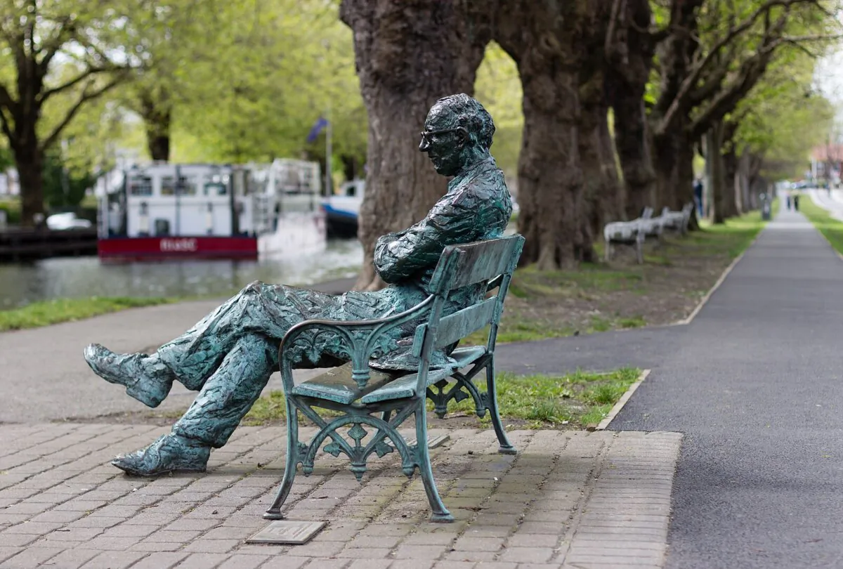 A statue of Patrick Kavanagh along the Grand Canal in Dublin. Patrick Kavanagh's poem "Canal Bank Walk" shared his love of nature. (Peierls/CC BY-SA 3.0)