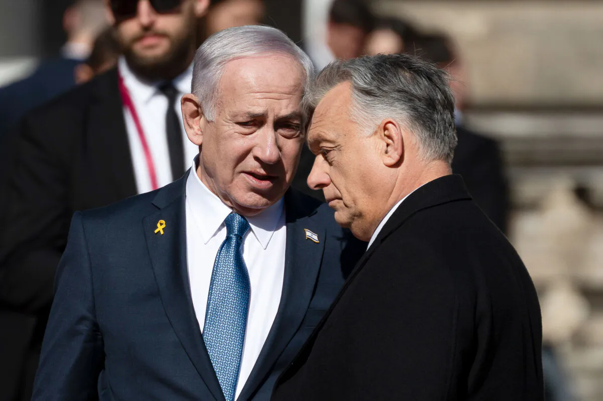 Israeli Prime Minister Benjamin Netanyahu (L) and Hungarian Prime Minister Viktor Orban talk after a welcoming ceremony with a guard of honor at Buda Castle in Budapest, Hungary, on April 3, 2025. (Denes Erdos/AP Photo)