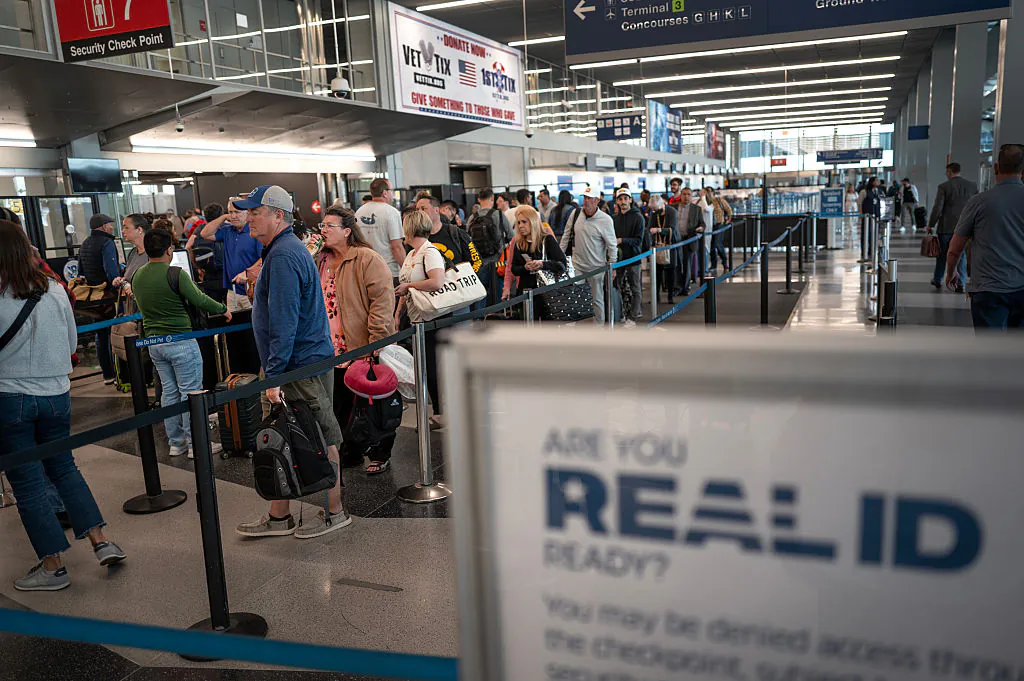 Passengers go through an airport security checkpoint at O'Hare International Airport in Chicago, Ill., on May 7, 2025. (Scott Olson/Getty Images)