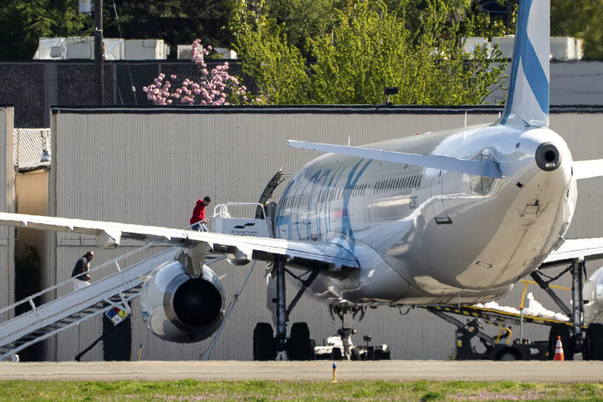 Detainees board a plane chartered by U.S. Immigration and Customs Enforcement (ICE) at King County International Airport in Seattle, Wash., on April 15, 2025. (David Ryder/Getty Images)