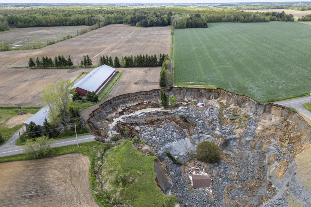 Landslide Sweeps Home, Road, Evacuates Homes Northeast Montreal