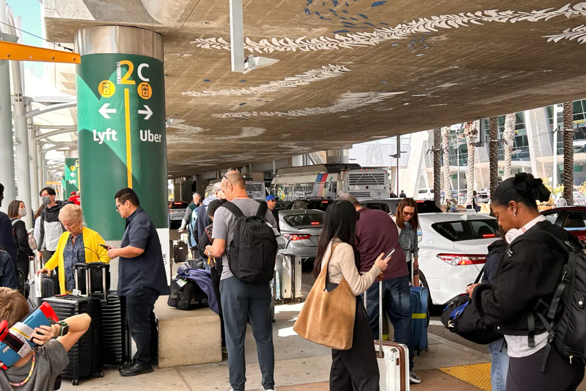 Passengers waiting for Uber or Lyft at San Diego International Airport on March 20, 2025. (Jane Yang/The Epoch Times)