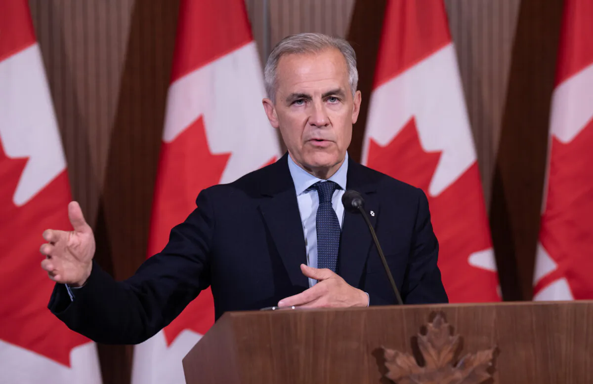 Prime Minister Mark Carney speaks with reporters during an availability following a cabinet retreat on May 21, 2025, in Ottawa.  (THE CANADIAN PRESS/Adrian Wyld)
