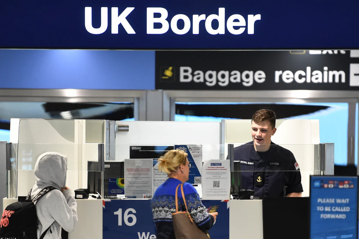 A member of the military at the passport control at Manchester airport, Manchester, England, on Dec. 28, 2022. (Peter Powell/PA)