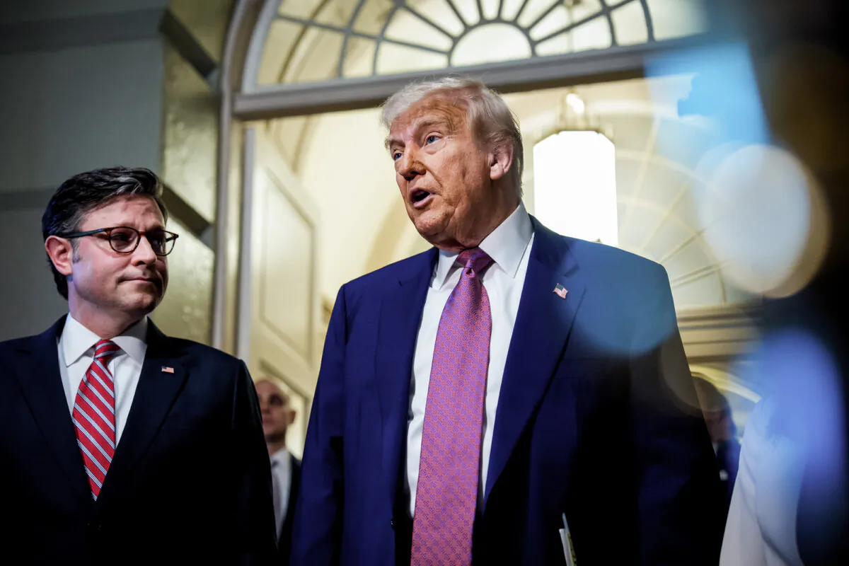 President Donald Trump, accompanied by Speaker of the House Mike Johnson (R-La.), speaks to members of the media as he arrives for a House Republican meeting at the U.S. Capitol on May 20, 2025. (Andrew Harnik/Getty Images)