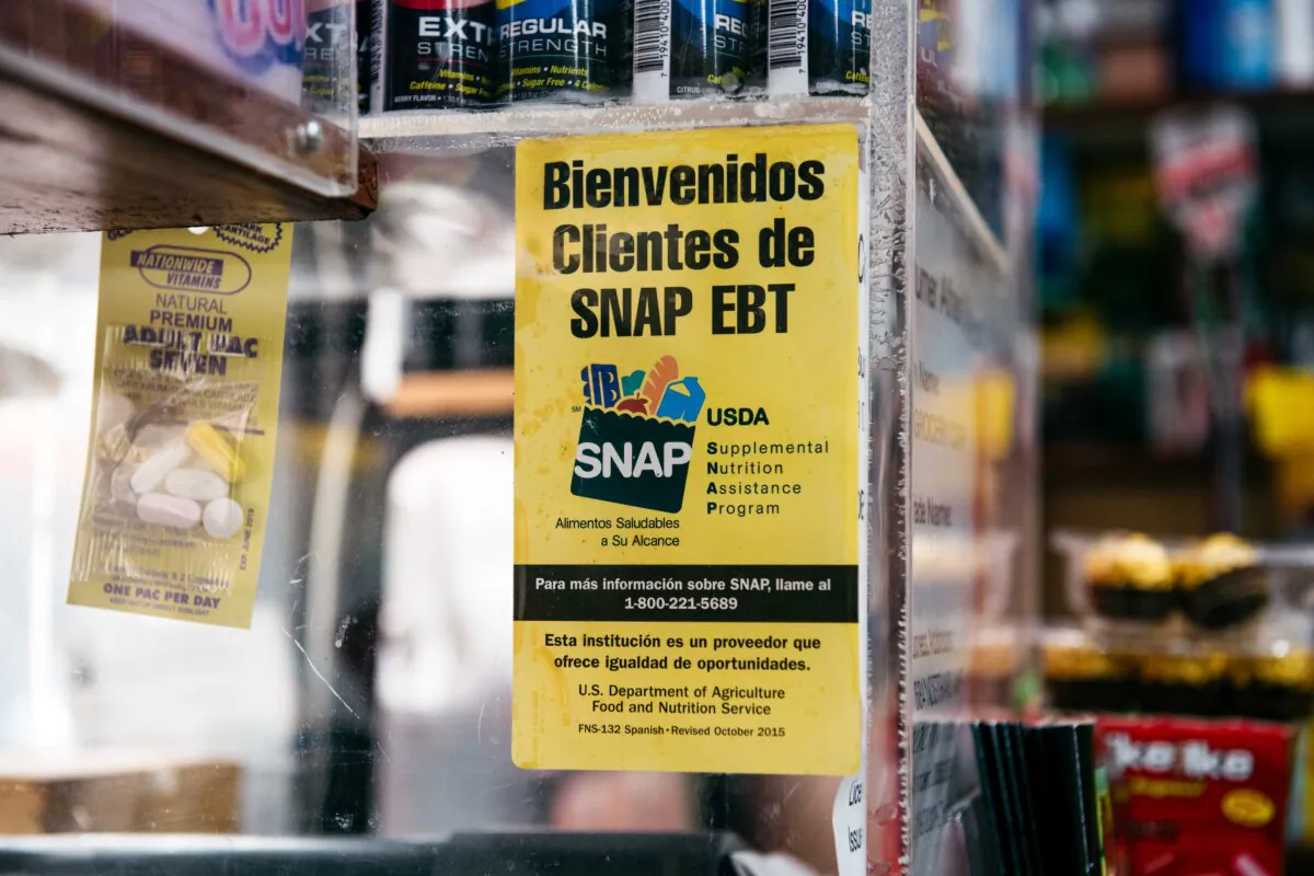 A sign alerting customers about SNAP food stamps benefits is displayed in a Brooklyn grocery store in New York City, on Dec. 5, 2019. (Scott Heins / Getty Images)