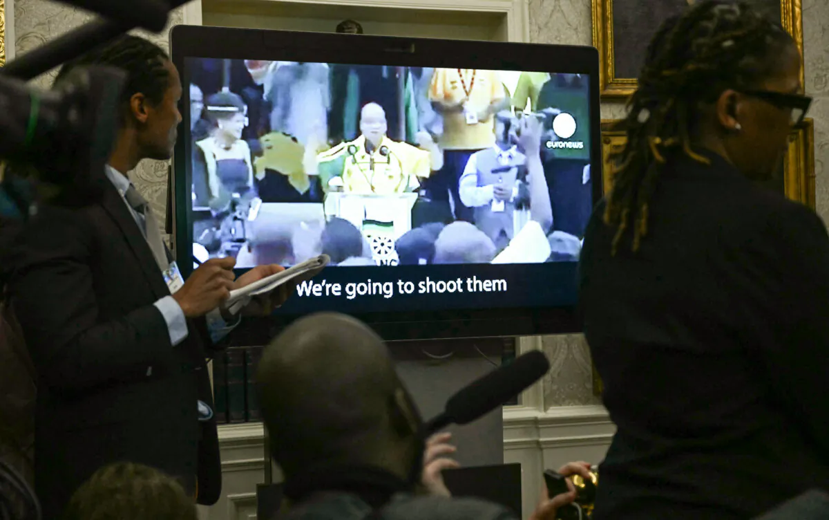 A video is played as South African President Cyril Ramaphosa meets with President Donald Trump in the Oval Office on May 21, 2025. (Jim Watson/AFP via Getty Images)