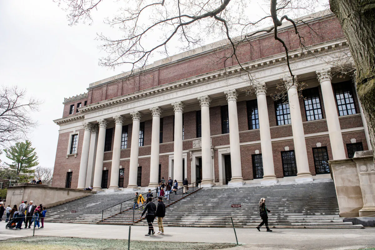 People enter and exit the Harry Elkins Widener Memorial Library on the Harvard University campus in Cambridge, Mass., on April 15, 2025. (Photo by Joseph Prezioso / AFP)