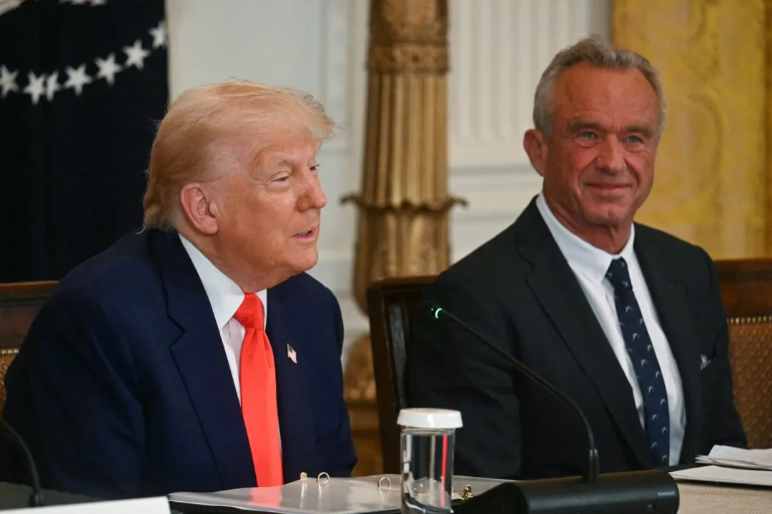 President Donald Trump speaks as Health Secretary Robert F. Kennedy Jr. looks on during a Make America Healthy Again Commission event in the White House on May 22, 2025. (Jim Watson/AFP via Getty Images)