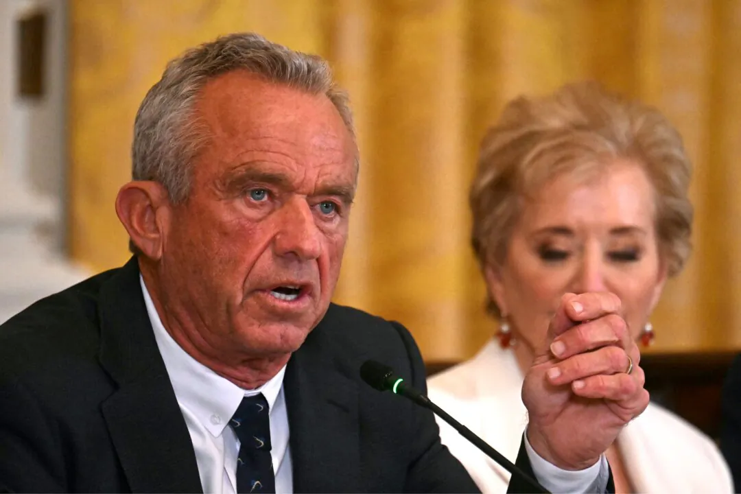 Secretary of Health and Human Services Robert F. Kennedy Jr. (L) gestures as he speaks as Secretary of Education Linda McMahon looks on during a MAHA (Make America Healthy Again) Commission Event in the White House on May 22, 2025. (Jim Watson/AFP via Getty Images)