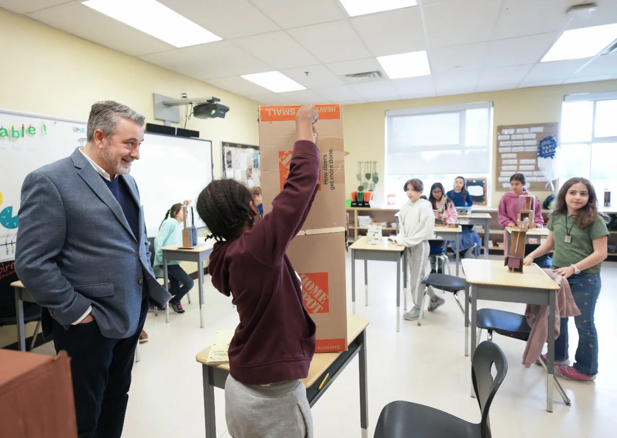 Ontario Education Minister Paul Calandra visits students in the classroom of a school in Stouffville, Ont., on May 2, 2025. (The Canadian Press/Nathan Denette)