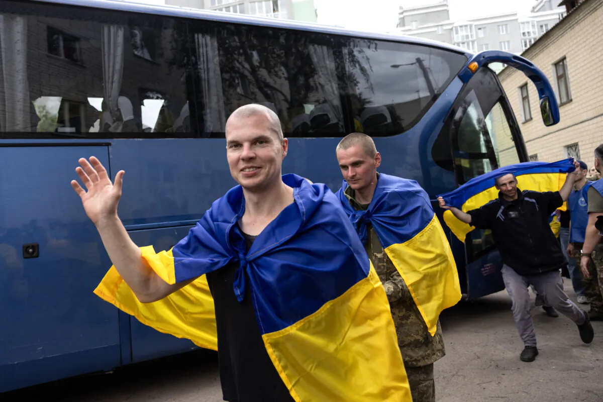 Ukrainian prisoners of war disembark from a bus after being released after months in a Russian prison in Chernihiv, Ukraine, on May 24, 2025. (Paula Bronstein/Getty Images)