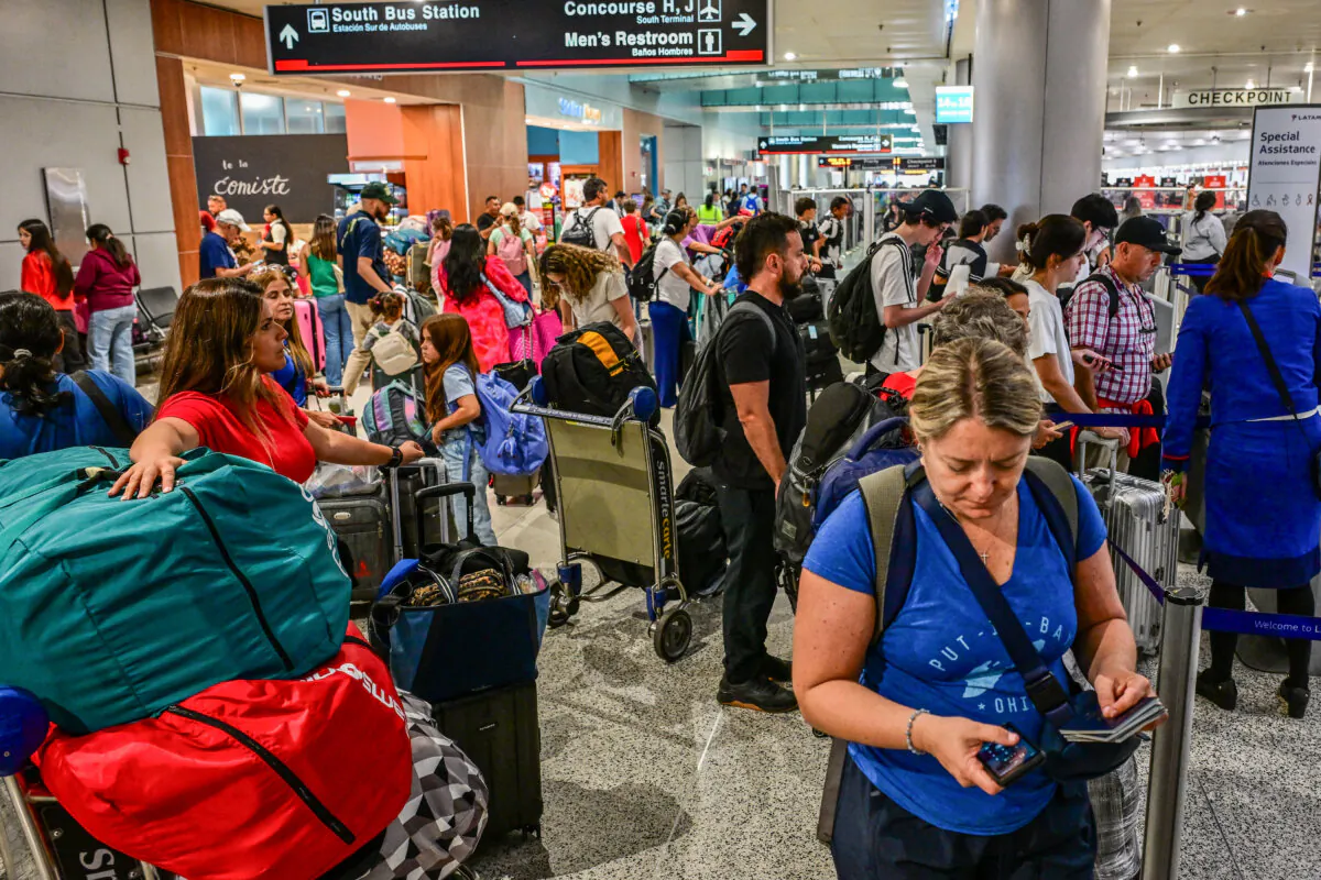 Travelers queue at Miami International Airport during Memorial Day weekend in Miami, Fla., on May 24, 2025. (Giorgio VIera/AFP via Getty Images)