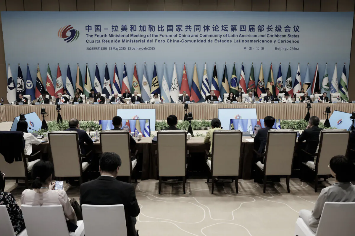 Chinese Foreign Minister Wang Yi (C) speaks during a plenary session of the China–Community of Latin American and Caribbean States Forum ministerial meeting in Beijing on May 13, 2025. (Florence Lo/Pool via Getty Images)