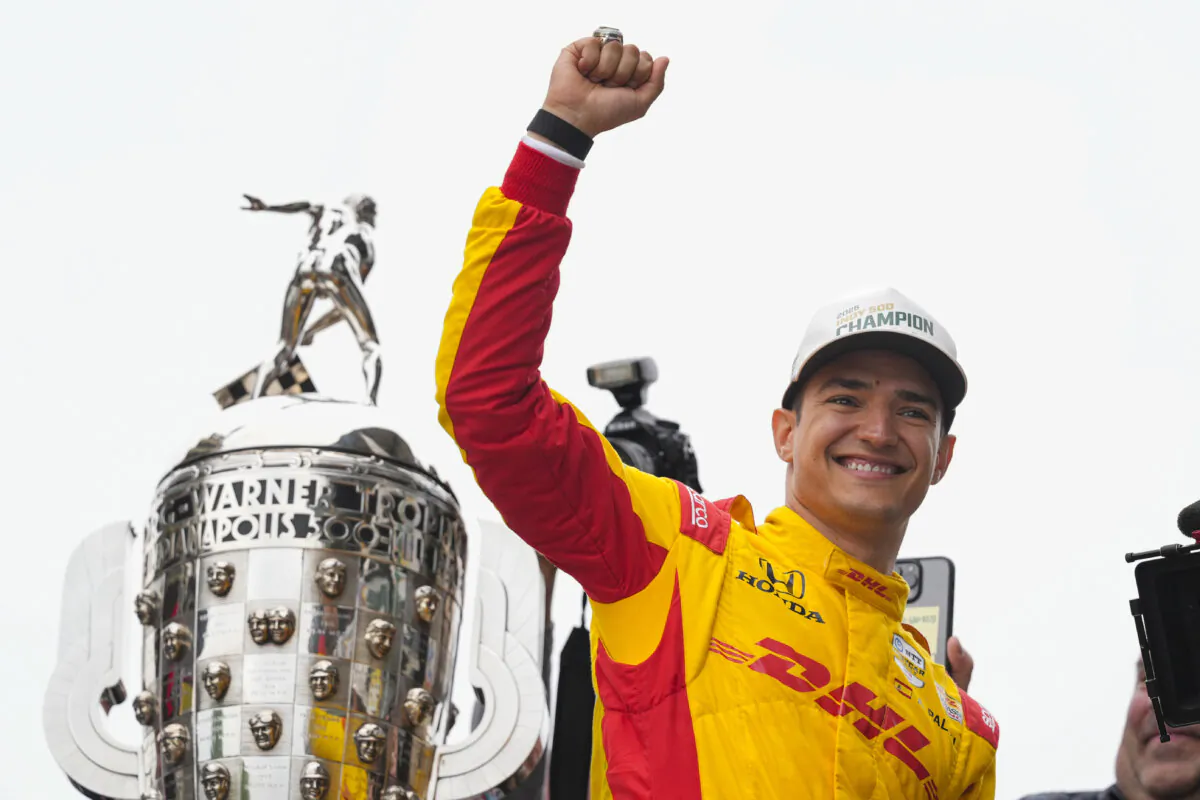 Alex Palou of Spain celebrates with fans after winning the Indianapolis 500 auto race at Indianapolis Motor Speedway in Indianapolis on May 25, 2025. (Michael Conroy/AP Photo)