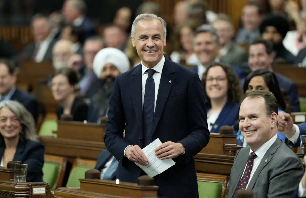 Prime Minister Mark Carney smiles as he rises for the first time in the House of Commons following the election of the speaker in Ottawa on May 26, 2025. (The Canadian Press/Adrian Wyld) 