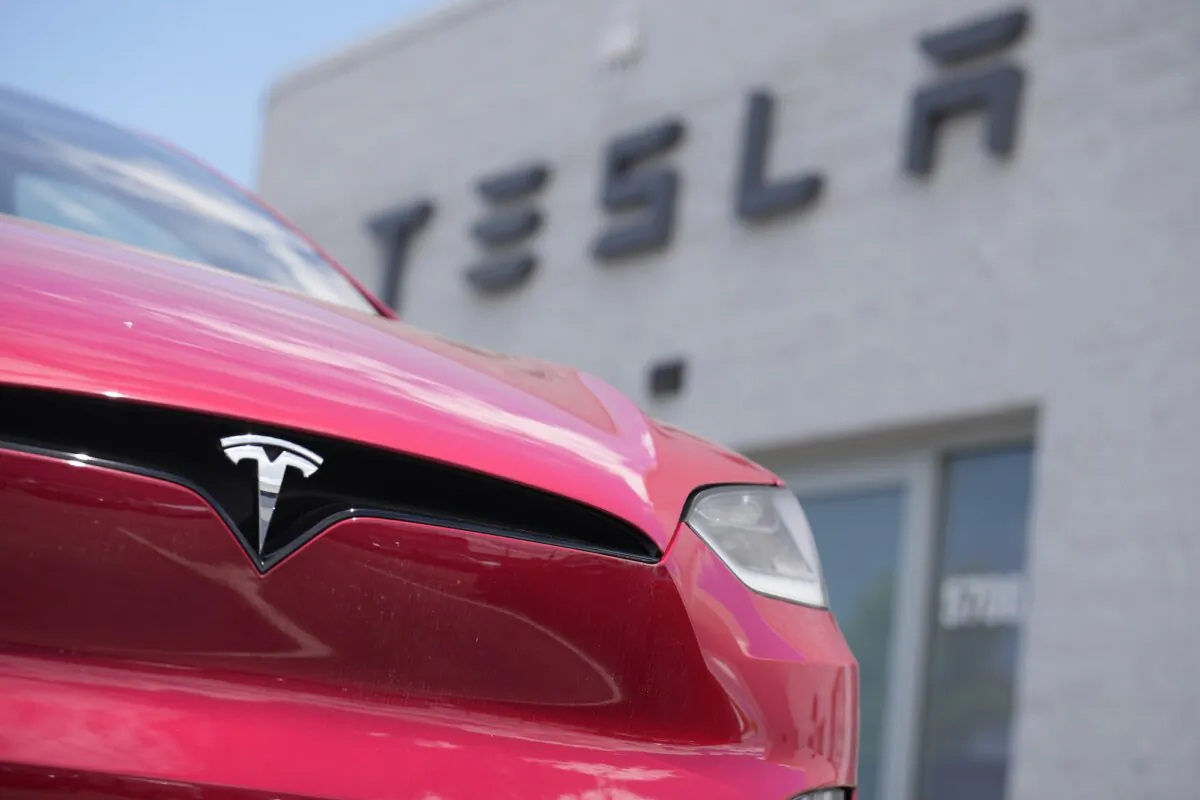 A Tesla Model X sits outside a Tesla store in Littleton, Colo., in a file photo. (David Zalubowski/AP Photo)