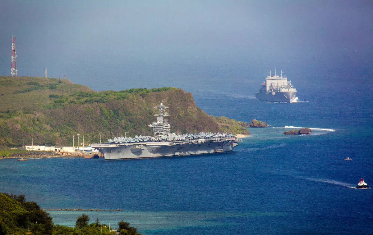The aircraft carrier USS Theodore Roosevelt is docked at Naval Base Guam in Apra Harbor on April 27, 2020. (Tony Azios/AFP via Getty Images)