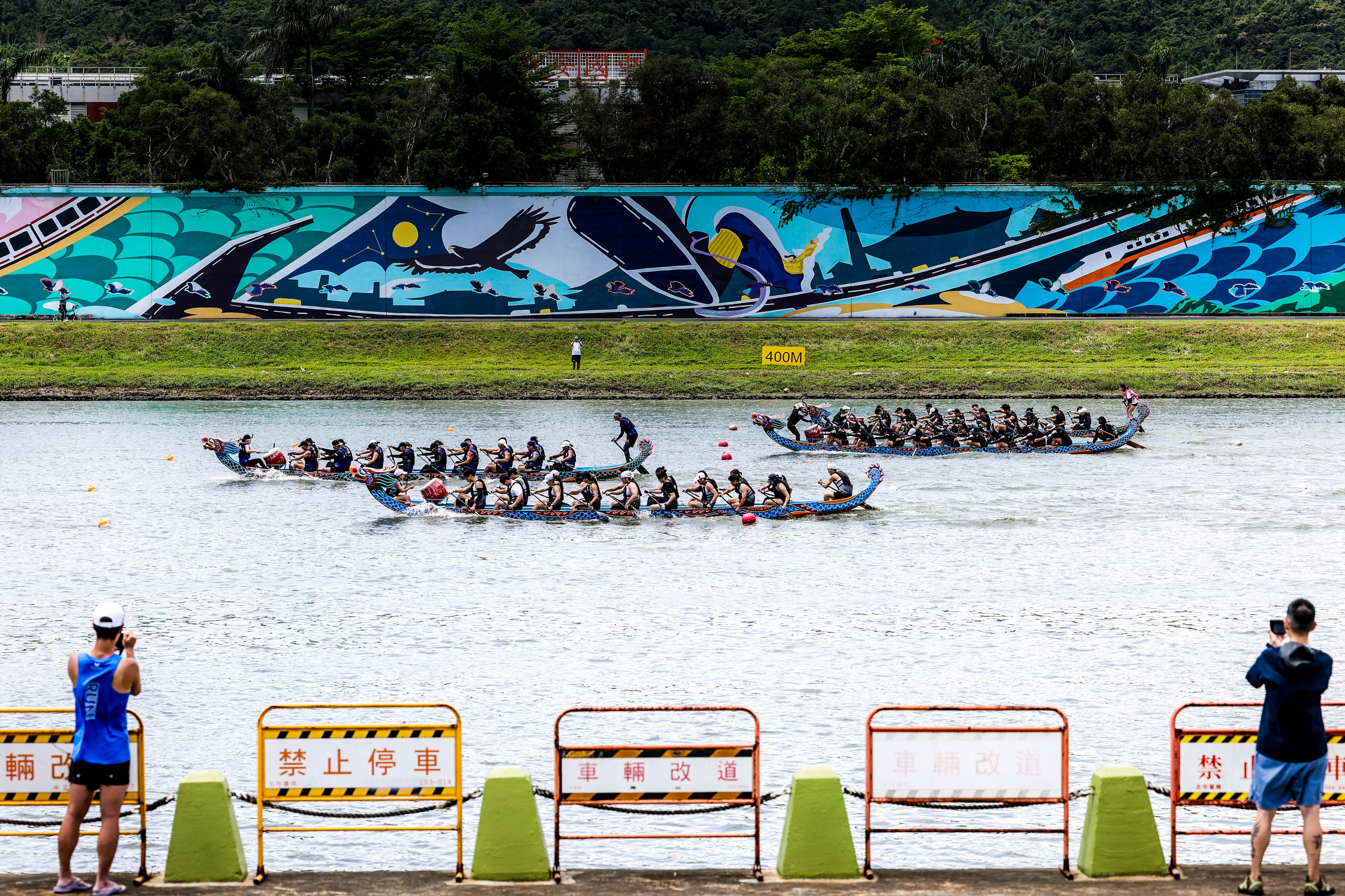 Day in Photos: Dragon Boat Race, Heavy Rainfall in Pakistan, and Young Malay Bear