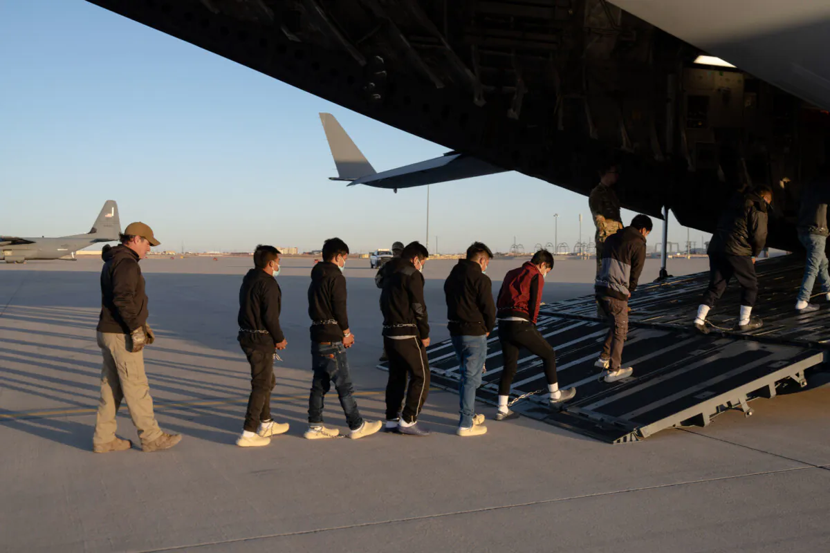 U.S. Customs and Border Protection security agents guide illegal immigrants onboard a C-17 Globemaster III for a removal flight at Fort Bliss, Texas, on Jan. 23, 2025. (Dept. of Defense photo by U.S. Army Sgt. 1st Class Nicholas J. De La Pena)