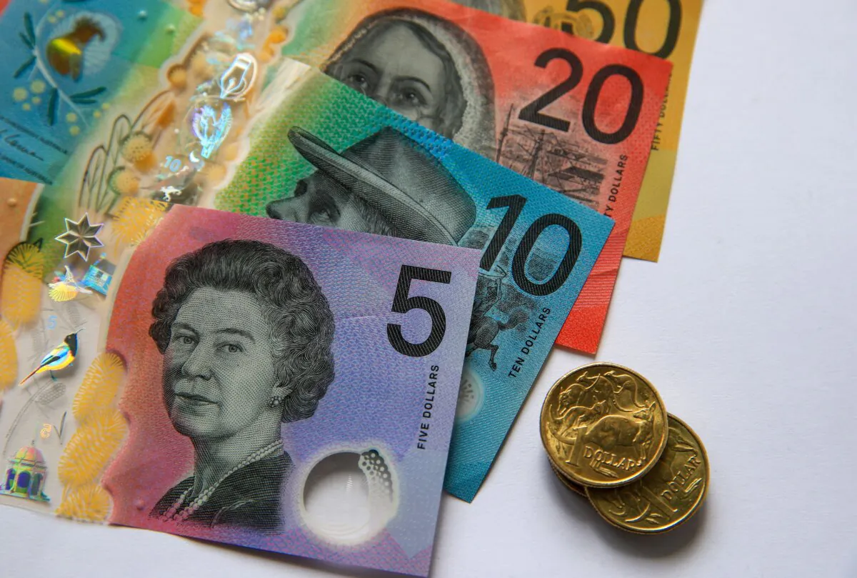 Australian $50, $20, $10 and $5 banknotes and dollar coins in Newcastle, Australia, on March 25, 2025. (Roni Bintang/Getty Images)