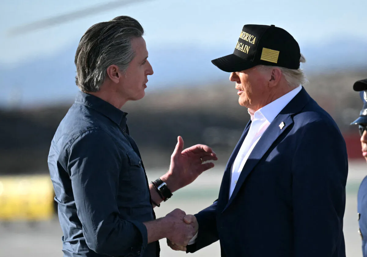 President Donald Trump (R) shakes hands with California Gov. Gavin Newsom upon arrival at Los Angeles International Airport on Jan. 24, 2025. (Mandel Ngan/AFP via Getty Images)
