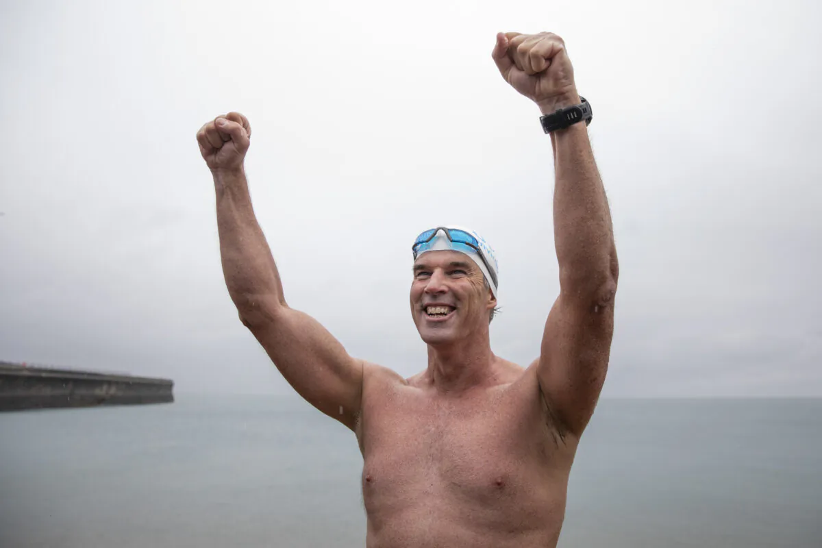 Lewis Pugh arrives on Shakespeare Beach after completing his 350-mile swim along the English Channel in Dover, England, on Aug. 29, 2018. (Dan Kitwood/Getty Images)